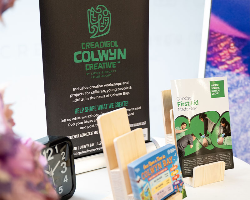 Creadigol Colwyn Creative table with information leaflets
